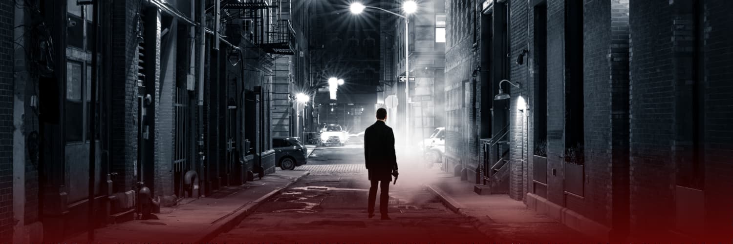 Image of Man with a Gun in an alley